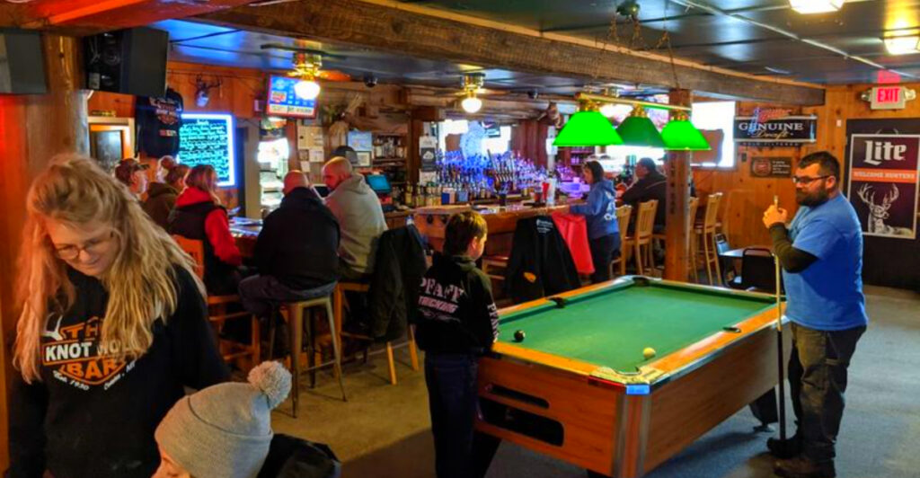 This Rustic Northern Michigan Bar Has BLT Pizza, Knotty Pine Walls, and a Patio That Feels Like a Summer Camp for Adults
