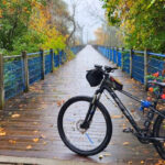 This Scenic Michigan Trail Lets You Ride Past Sand Dunes, Historic Ships, and Lake Michigan Views All in One Trip