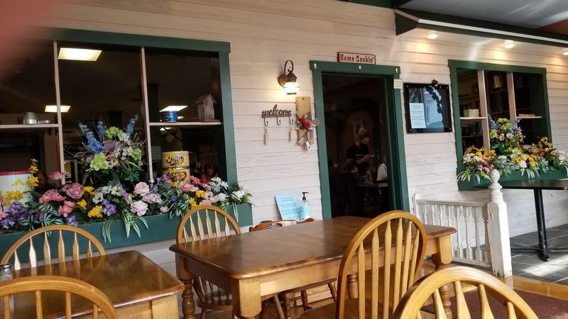 The Atmosphere Inside: Floral Decor, Mismatched Chairs, and a Whole Lot of Warmth