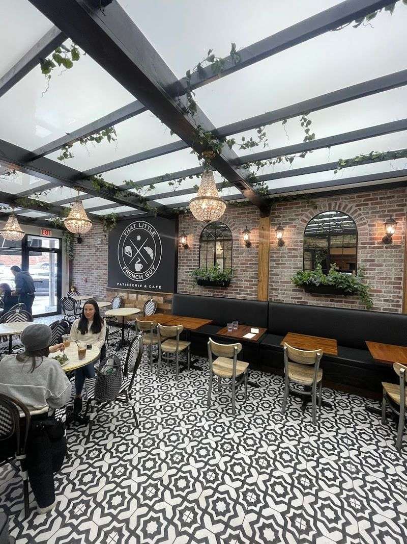 The Atmosphere Inside: Warm Wood, Vintage Posters, and Parisian Vibes