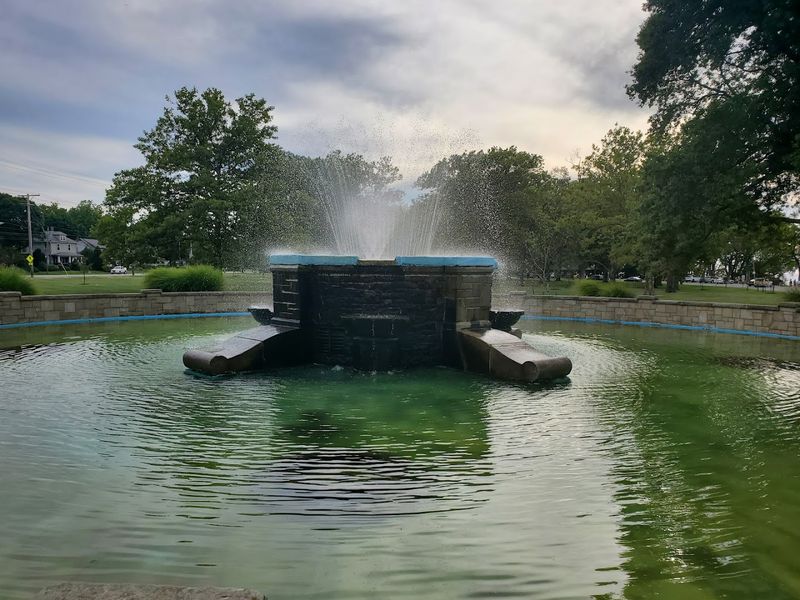 The Fountain That Anchors the Park's Open Lawn