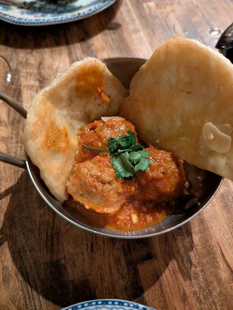 The Lamb Meatballs in Tomato-Ginger Curry: The Dish That Defines the Menu The Lamb Meatballs in Tomato-Ginger Curry: The Dish That Defines the Menu
