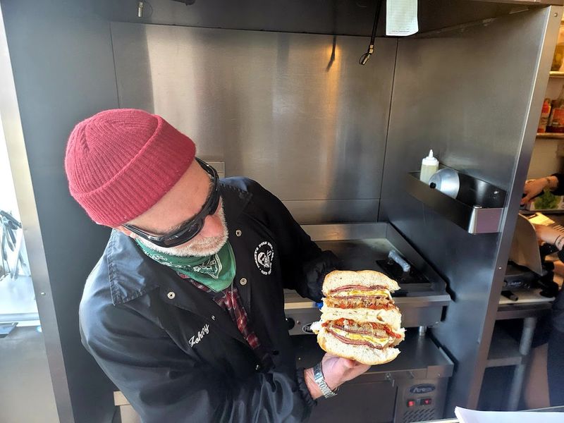 The Owner Behind the Grill The Owner Behind the Grill