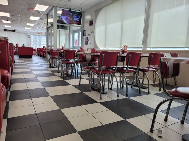 The Story Behind the Red Booths and Checkerboard Floors