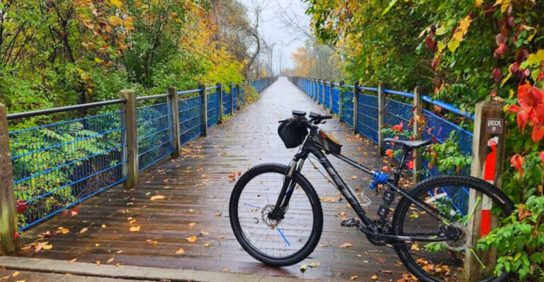 This Scenic Michigan Trail Lets You Ride Past Sand Dunes, Historic Ships, and Lake Michigan Views All in One Trip