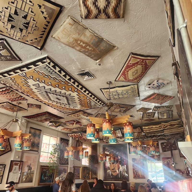 Western Art Covering Every Wall and the Ceiling Too