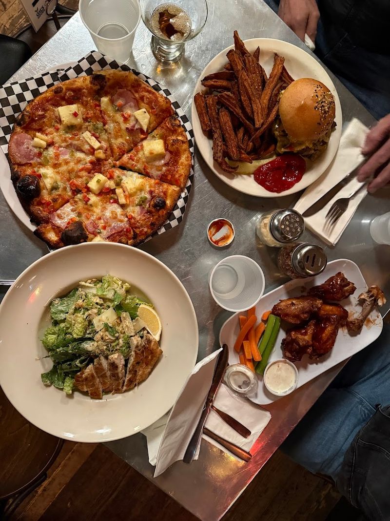 Wood-Fired Pizzas That Bring People Back Again and Again Wood-Fired Pizzas That Bring People Back Again and Again