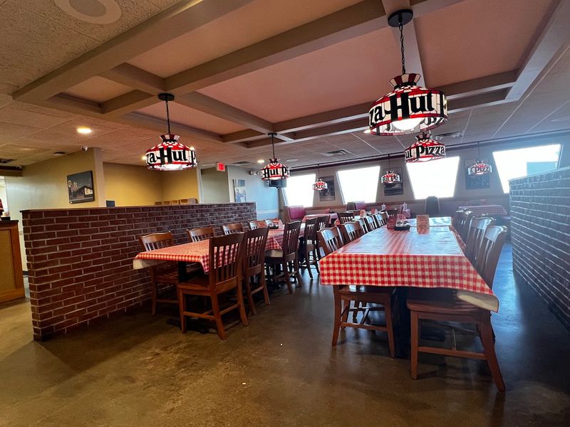 Red Booths, Checkered Tablecloths, and That Unmistakable Vibe