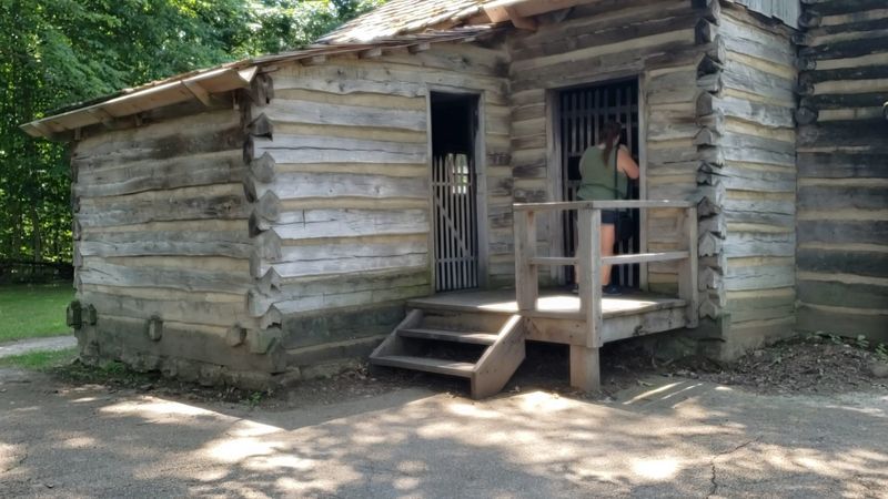 The Reconstructed Village: Log Cabins Built on Real Foundations