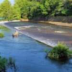 This 18-Mile Oklahoma Trail Crosses a Swinging Bridge Before Looping Through the Hills Around Greenleaf Lake