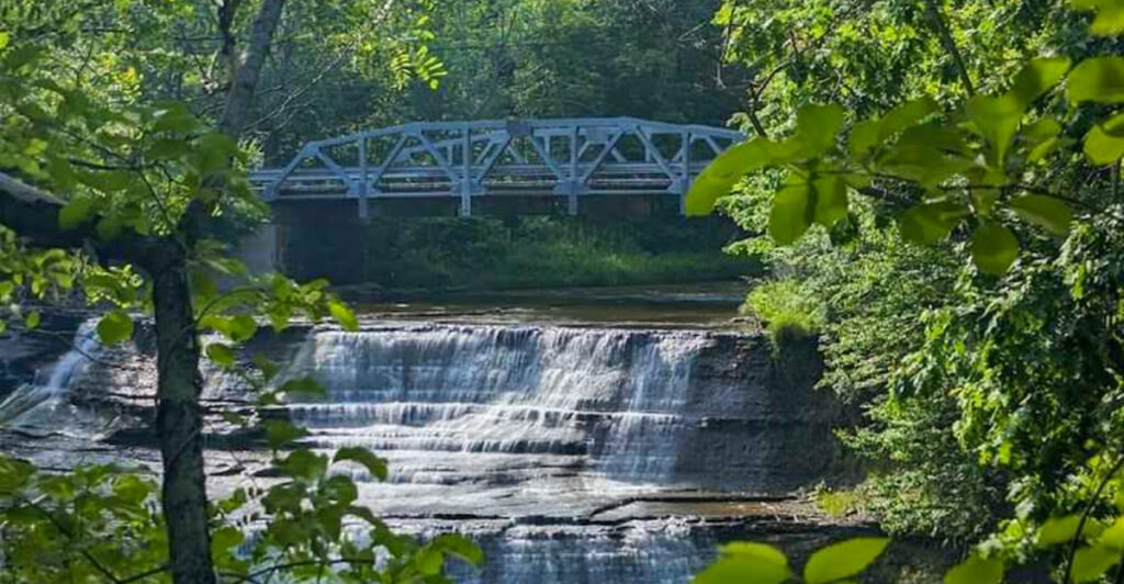 This Ohio Park Hides a Beautiful Waterfall Beneath a Scenic Suspension Bridge