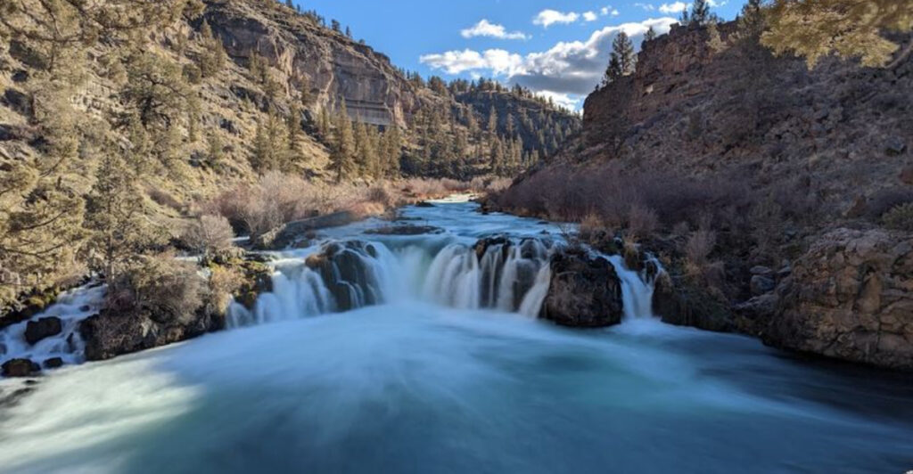 This Oregon Swimming Hole Sits Below a 20-Foot Waterfall Carved Into a Colorful Desert Canyon