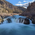 This Oregon Swimming Hole Sits Below a 20-Foot Waterfall Carved Into a Colorful Desert Canyon
