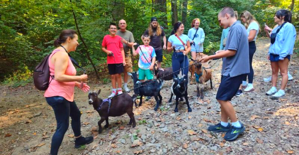 This Pennsylvania Farm Sanctuary Lets You Feed Baby Goats, Meet Camels, and Even Go Goat Hiking
