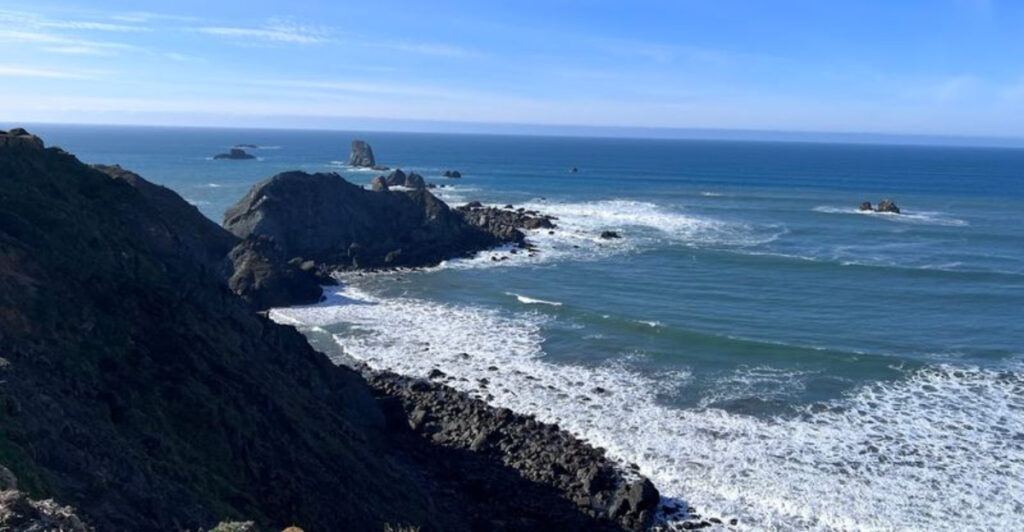 This Underrated Oregon Beach Is a Rare Blend of Black Sand and Sea Caves