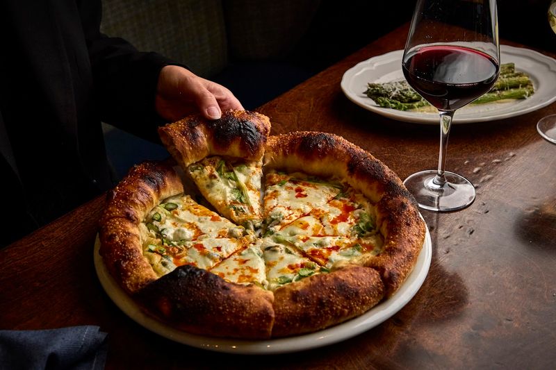 Wood-Fired Pizza at the Heart of the Menu Wood-Fired Pizza at the Heart of the Menu