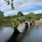 This 400-Foot Massachusetts Stone Bridge Turns Into a Flower-Covered Walkway People Return to Every Summer