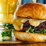 This Minnesota Burger Spot Is Famous for Smash Burgers Stacked Sky High