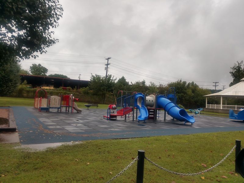 A Fenced Playground Built With Little Ones in Mind A Fenced Playground Built With Little Ones in Mind