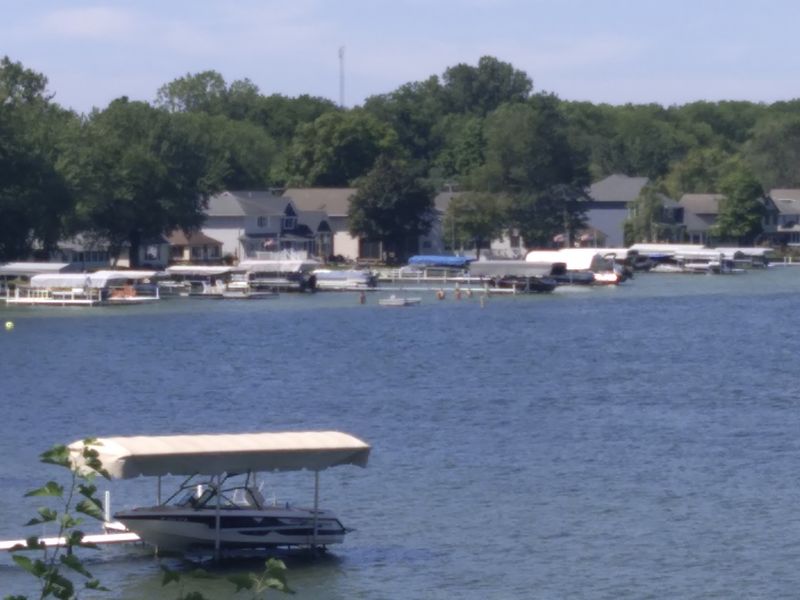 A Setting Framed by Cottages and Boats