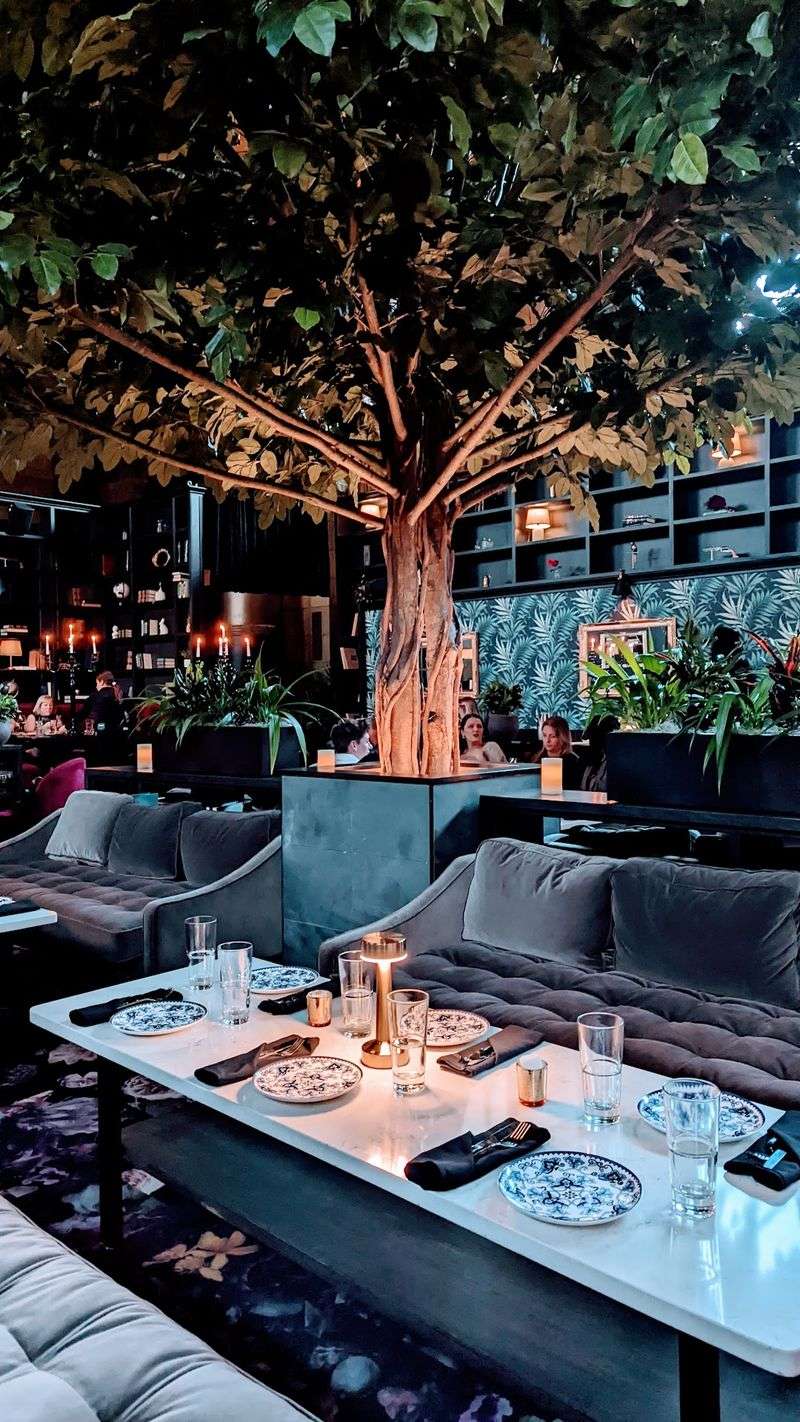 Candlelight, Bookcases, and Red Velvet Booths