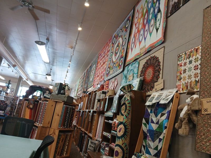 Inspiration Quilts Hanging Throughout the Shop