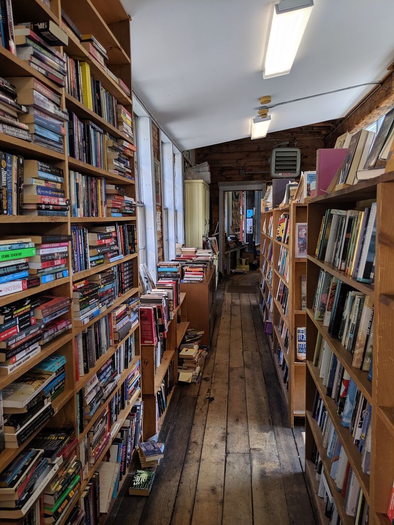 Shelves Stacked From Fiction to Faraway History