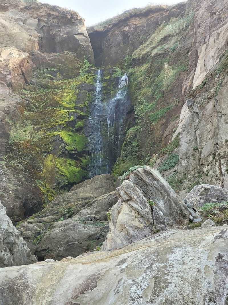 The Hidden Waterfall That Drops Onto the Beach The Hidden Waterfall That Drops Onto the Beach