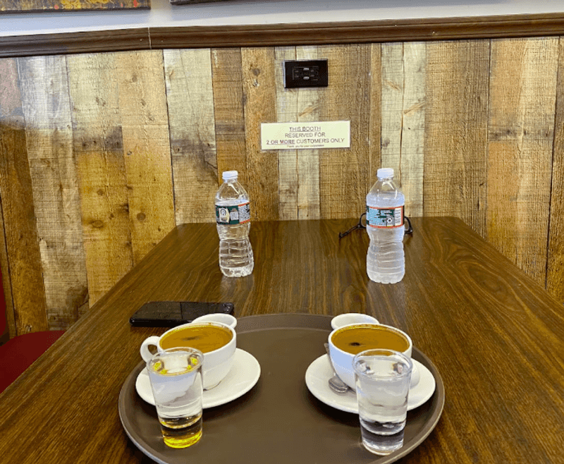 Turkish coffee beside shelves and study tables