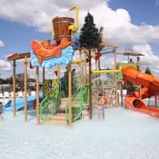 At This North Carolina Campground, Kids Get A Splash Pad, A Waterslide, And Three Pools To Roam