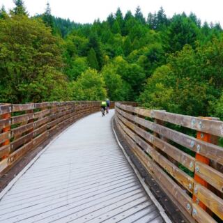 This 21-Mile Oregon Bike Trail Follows An Old Railroad Past 13 Bridges, Including Historic Railroad Trestles, and Small Communities