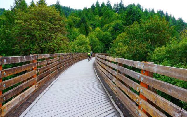 This 21-Mile Oregon Bike Trail Follows An Old Railroad Past 13 Bridges, Including Historic Railroad Trestles, and Small Communities