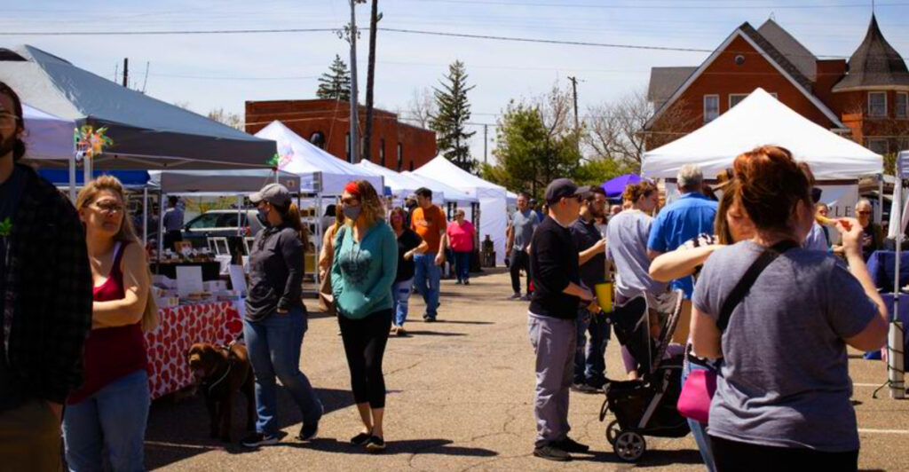 This Small Michigan Village Market Has 70+ Vendors, Fresh Bread, and a Train Rolling Through the Park