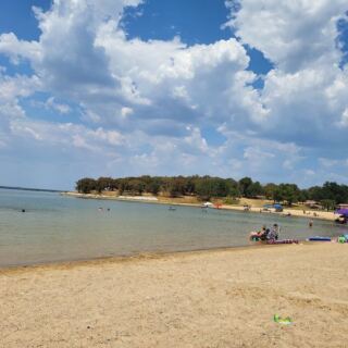 At this North Texas state park, deer roam right up to a big sandy lake beach made for family swim days