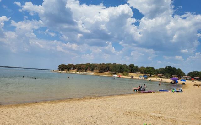 At this North Texas state park, deer roam right up to a big sandy lake beach made for family swim days