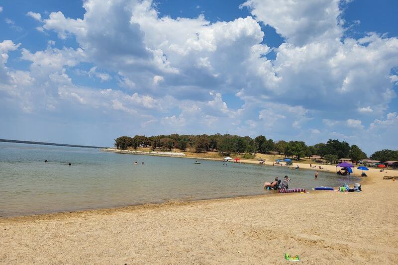 At this North Texas state park, deer roam right up to a big sandy lake beach made for family swim days