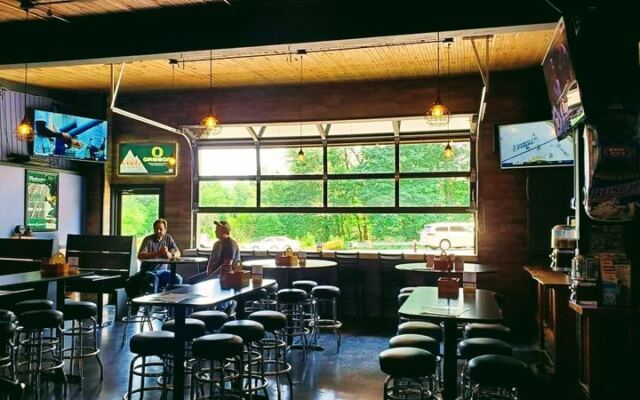 This No-Frills Oregon Roadhouse Pairs Live Music With Pinball, Pool, And Roll-Up-Door Patio Days