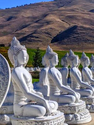 This Peaceful Montana Garden Surrounds a Giant Dharma Wheel With 1,000 Buddha Statues