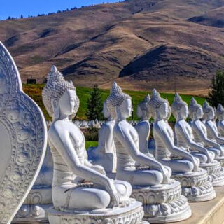 This Peaceful Montana Garden Surrounds a Giant Dharma Wheel With 1,000 Buddha Statues