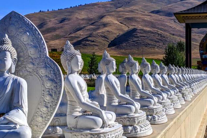 This Peaceful Montana Garden Surrounds a Giant Dharma Wheel With 1,000 Buddha Statues