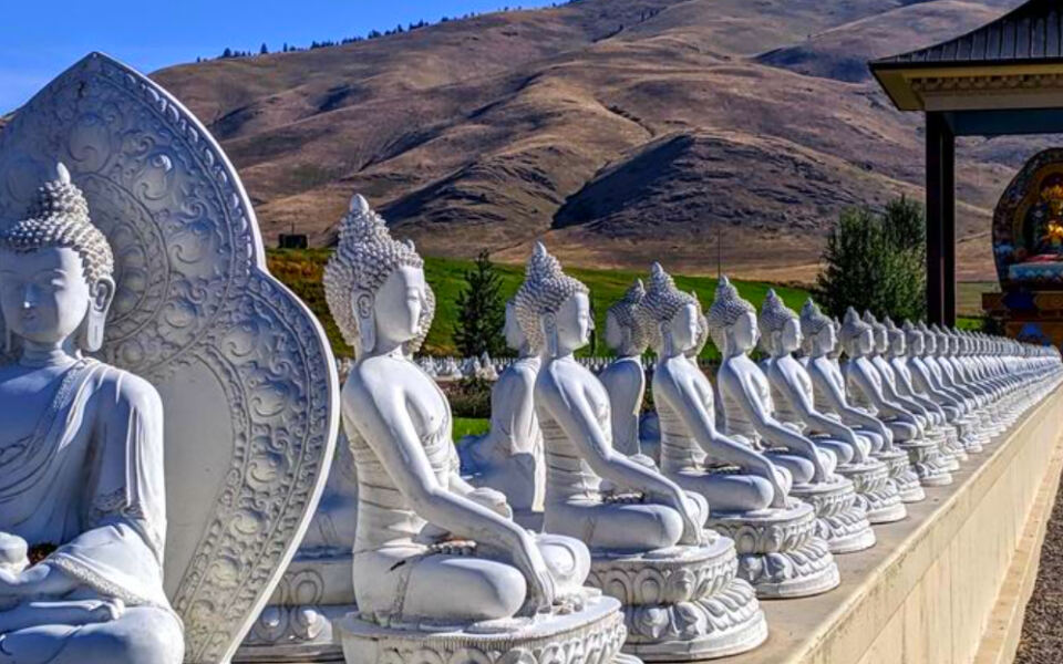 This Peaceful Montana Garden Surrounds a Giant Dharma Wheel With 1,000 Buddha Statues