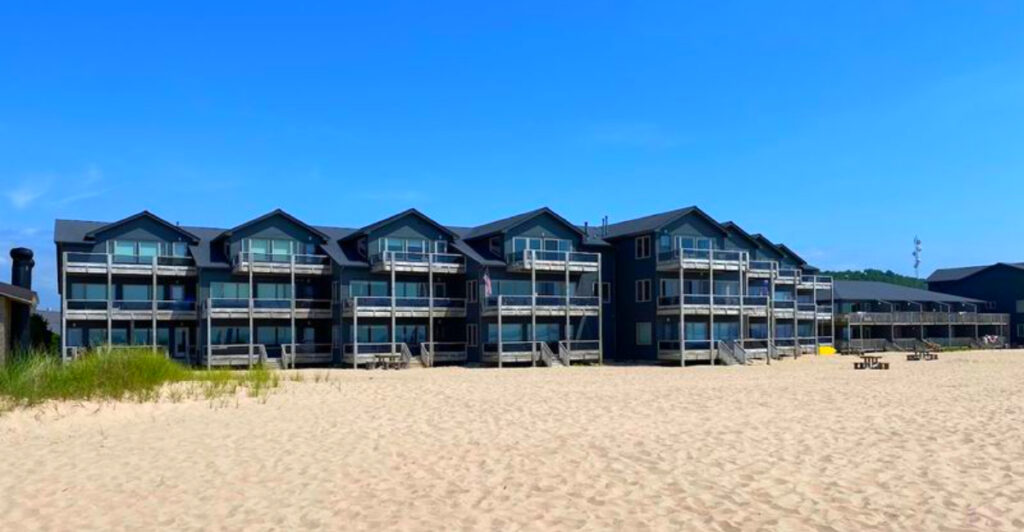 This Michigan Lakefront Resort Has Private Beach Access, Lighthouse Views, and Stunning Sunsets