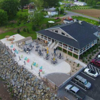 This Pennsylvania Creekside Restaurant Has a Tiki Bar, Real Sand, and Mountain Views