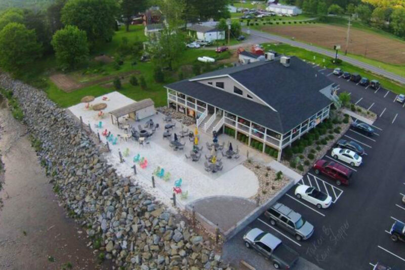 This Pennsylvania Creekside Restaurant Has a Tiki Bar, Real Sand, and Mountain Views