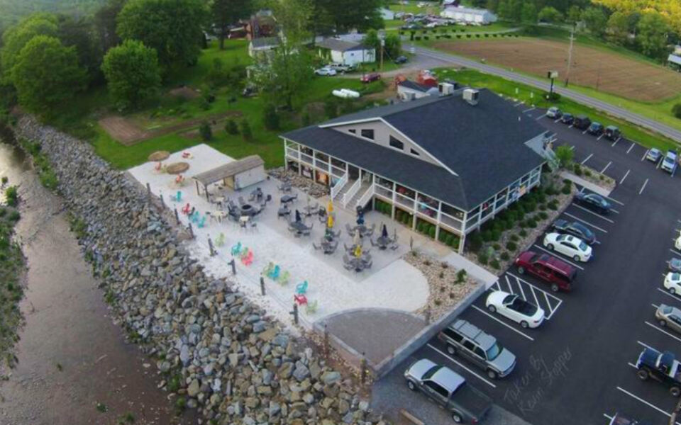 This Pennsylvania Creekside Restaurant Has a Tiki Bar, Real Sand, and Mountain Views