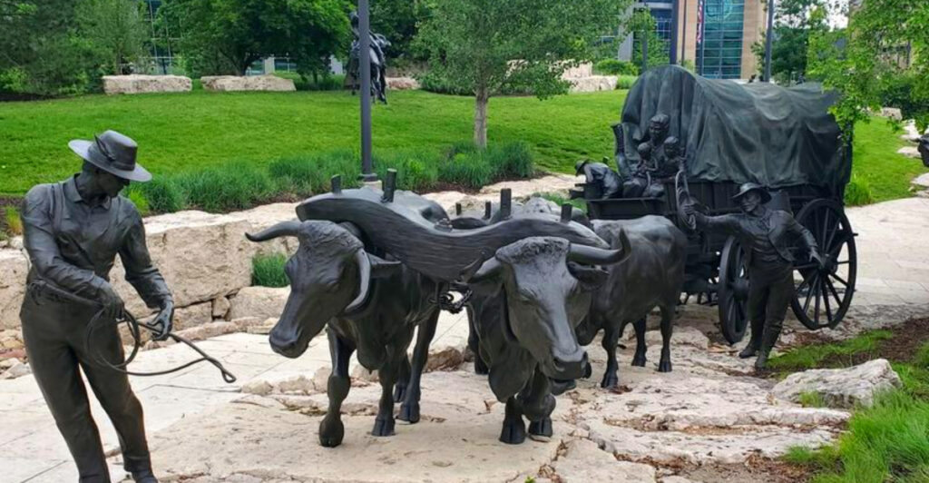 This Free Omaha Sculpture Park Has Giant Bronze Wagons, Bison, and Pioneers Across Six City Blocks