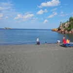 This Minnesota Beach Looks Volcanic, But Its Black Sand Has A Different Story