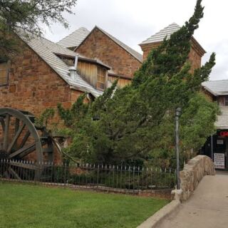This Historic Texas Restaurant Serves Down-Home Comfort Food Beside a Working Water Wheel and Little Bridge