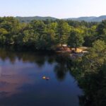 This New York Campground Hides a Sandy Lakefront Beach and a Splash Pad for the Kids