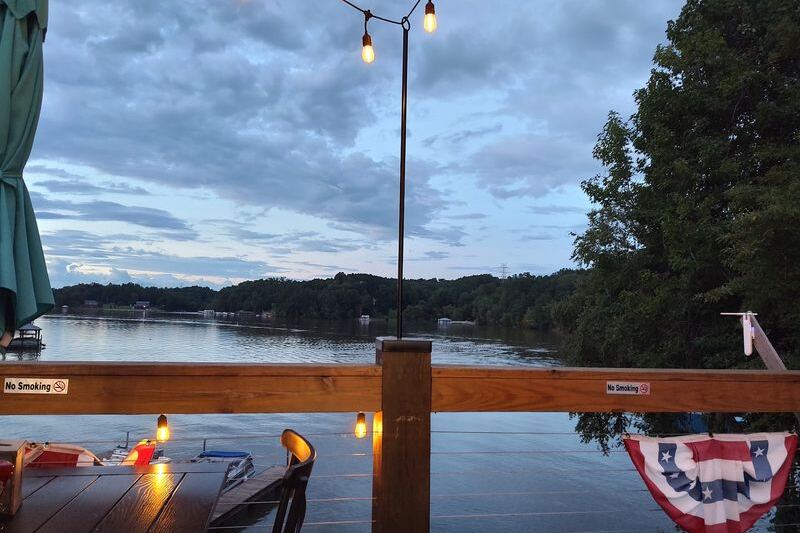 This Laid-Back North Carolina Lakeside Grill Serves Live Music, Cold Drinks, And Boats Drifting By The Deck